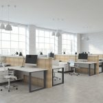 Modern white brick coworking office interior with furniture, equipment and city view with sunlight. 3D Rendering